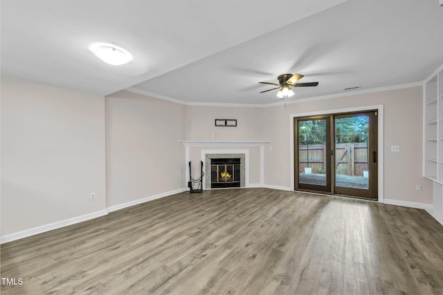 2233 Alpine Rd, Durham, NC 27707 - unfurnished living room featuring wood finished floors, ornamental molding, a high end fireplace, and ceiling fan