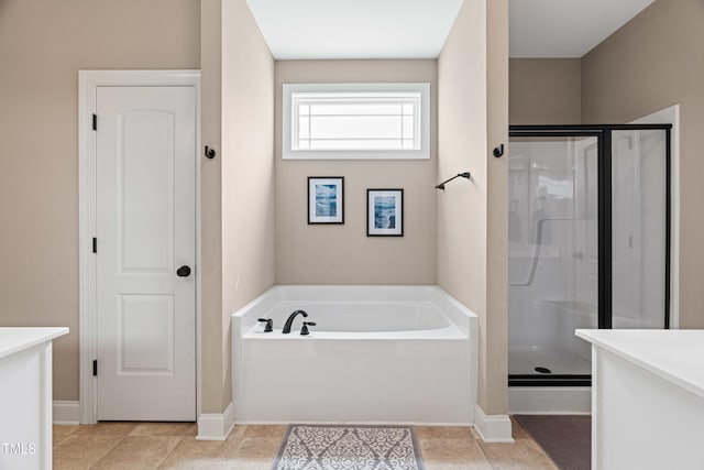 20 Kola Nut, Smithfield, NC 27577 - bathroom featuring a shower stall, a bath, and tile patterned flooring
