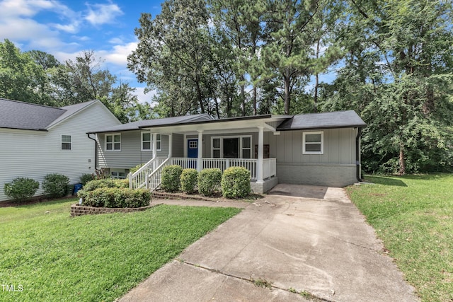 1316 Foxrun Dr, Raleigh, NC 27610 - single story home with covered porch, a front yard, and board and batten siding