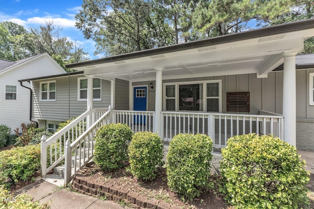 1316 Foxrun Dr, Raleigh, NC 27610 - view of front of house featuring covered porch and board and batten siding