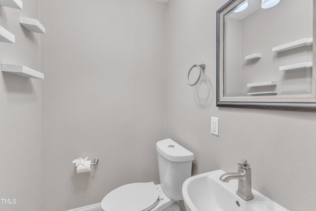 1316 Foxrun Dr, Raleigh, NC 27610 - half bathroom with a sink and toilet