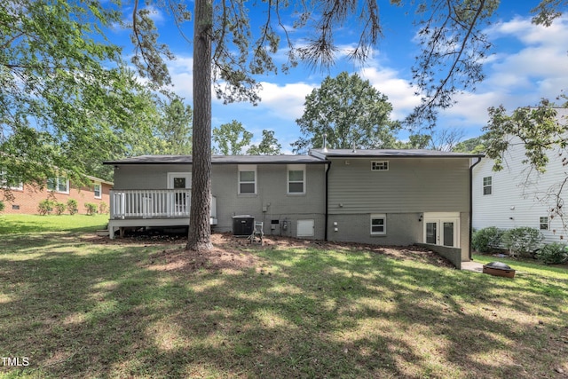 1316 Foxrun Dr, Raleigh, NC 27610 - back of house with french doors, a lawn, a wooden deck, brick siding, and a fire pit