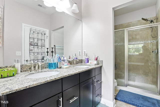 651 Berry Chase Way, Cary, NC 27519 - bathroom featuring double vanity, a stall shower, and tile patterned flooring