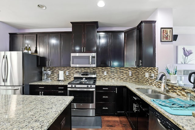 651 Berry Chase Way, Cary, NC 27519 - kitchen with stainless steel appliances, light stone counters, decorative backsplash, dark wood finished floors, and recessed lighting