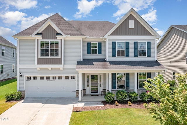 4611 Lazy Hollow Dr, Knightdale, NC 27545 - craftsman-style house featuring a porch, board and batten siding, driveway, and roof with shingles