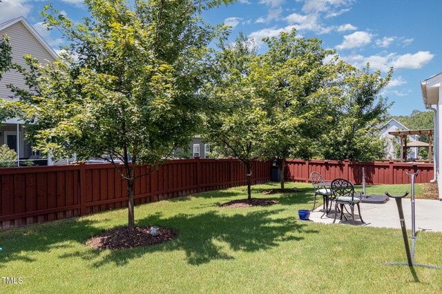 4611 Lazy Hollow Dr, Knightdale, NC 27545 - fenced backyard with a patio area