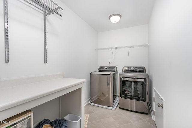 4611 Lazy Hollow Dr, Knightdale, NC 27545 - laundry room with independent washer and dryer and light tile patterned floors
