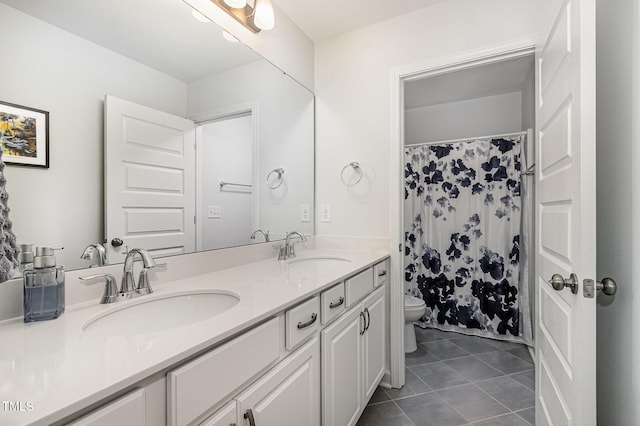4611 Lazy Hollow Dr, Knightdale, NC 27545 - bathroom featuring double vanity, tile patterned flooring, and a shower with curtain