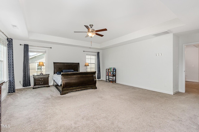 4611 Lazy Hollow Dr, Knightdale, NC 27545 - bedroom featuring a raised ceiling, carpet floors, and a ceiling fan
