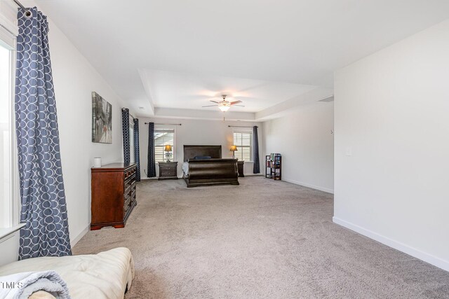 4611 Lazy Hollow Dr, Knightdale, NC 27545 - bedroom featuring a tray ceiling, carpet floors, and ceiling fan