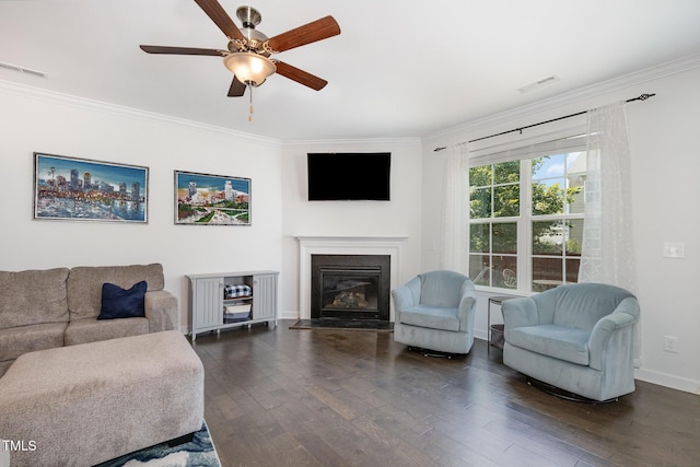 4611 Lazy Hollow Dr, Knightdale, NC 27545 - living room with ornamental molding, dark wood-style floors, ceiling fan, and a fireplace with flush hearth