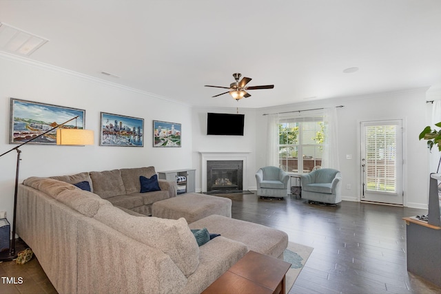4611 Lazy Hollow Dr, Knightdale, NC 27545 - living area featuring crown molding, ceiling fan, dark wood-style flooring, and a glass covered fireplace
