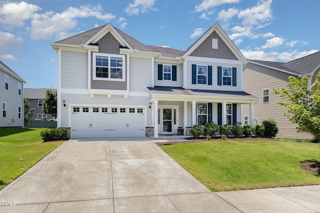 4611 Lazy Hollow Dr, Knightdale, NC 27545 - view of front of house with board and batten siding, driveway, a front lawn, a porch, and a garage