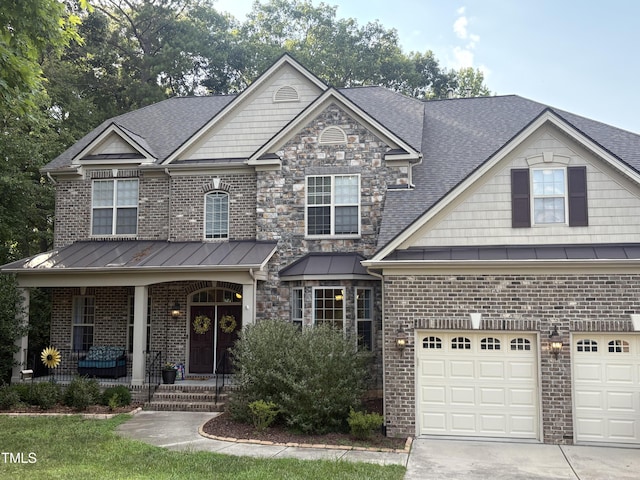 3521 Song Sparrow Dr, Wake Forest, NC 27587 - view of front of house featuring a porch, driveway, brick siding, and a standing seam roof