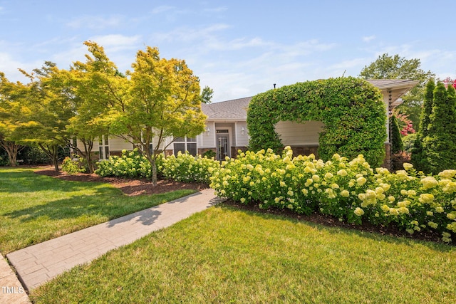 501 Tranquil Sound Dr, Cary, NC 27519 - obstructed view of property featuring a front yard