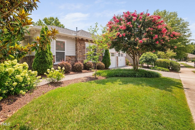 501 Tranquil Sound Dr, Cary, NC 27519 - view of front facade featuring stone siding, a front yard, a garage, and driveway