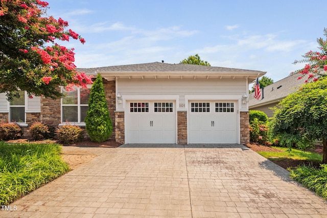 501 Tranquil Sound Dr, Cary, NC 27519 - view of front facade featuring stone siding, decorative driveway, and an attached garage