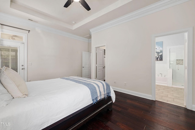 501 Tranquil Sound Dr, Cary, NC 27519 - bedroom with hardwood / wood-style flooring, a raised ceiling, ornamental molding, connected bathroom, and ceiling fan