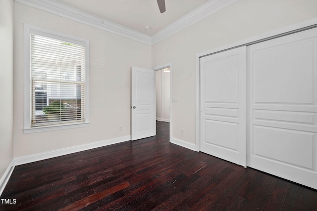 501 Tranquil Sound Dr, Cary, NC 27519 - unfurnished bedroom featuring dark wood-type flooring, crown molding, a closet, and a ceiling fan