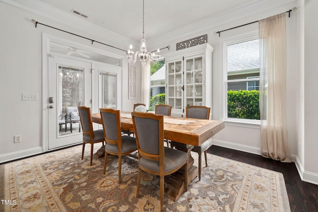 501 Tranquil Sound Dr, Cary, NC 27519 - dining area featuring a chandelier, plenty of natural light, dark wood-style flooring, and ornamental molding