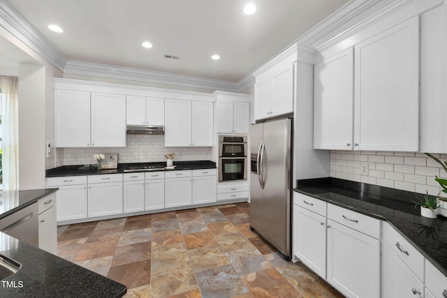 501 Tranquil Sound Dr, Cary, NC 27519 - kitchen with appliances with stainless steel finishes, under cabinet range hood, white cabinets, light stone finish floors, and decorative backsplash