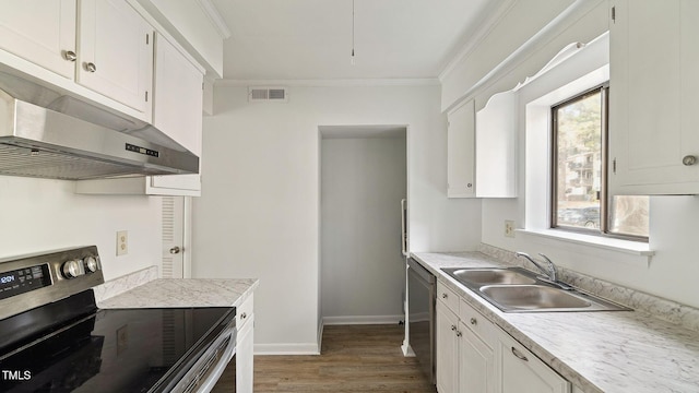 550 Pine Ridge Pl, Raleigh, NC 27609 - kitchen featuring appliances with stainless steel finishes, under cabinet range hood, ornamental molding, wood finished floors, and white cabinetry