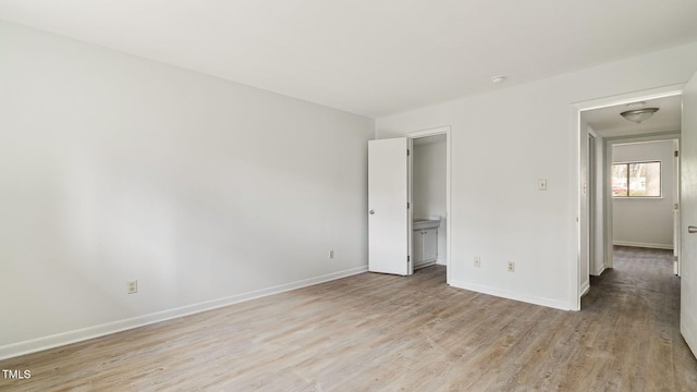 550 Pine Ridge Pl, Raleigh, NC 27609 - unfurnished bedroom featuring light wood-type flooring