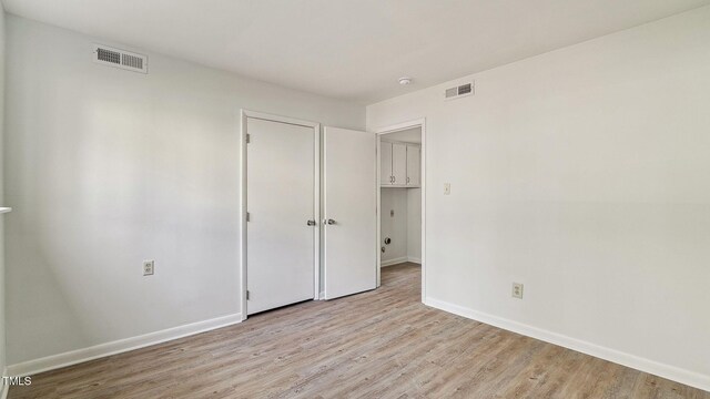 550 Pine Ridge Pl, Raleigh, NC 27609 - unfurnished bedroom featuring baseboards and light wood-style floors