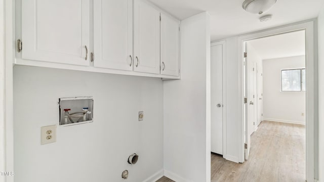 550 Pine Ridge Pl, Raleigh, NC 27609 - washroom with hookup for a washing machine, cabinet space, light wood-style flooring, and hookup for an electric dryer