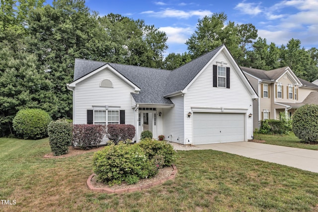 5513 Enoree Ln, Raleigh, NC 27616 - traditional-style home featuring concrete driveway, roof with shingles, a front lawn, and a garage