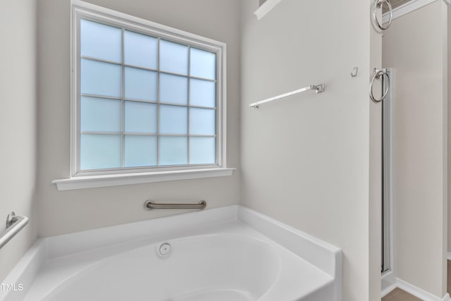5513 Enoree Ln, Raleigh, NC 27616 - bathroom with a bath and a stall shower