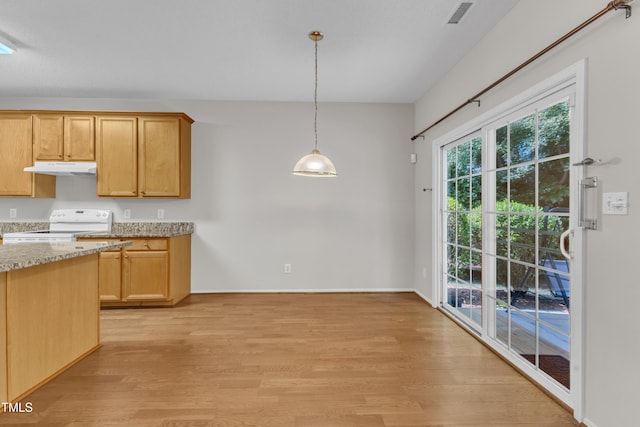 5513 Enoree Ln, Raleigh, NC 27616 - kitchen with under cabinet range hood, white range with electric stovetop, light wood finished floors, light stone countertops, and pendant lighting