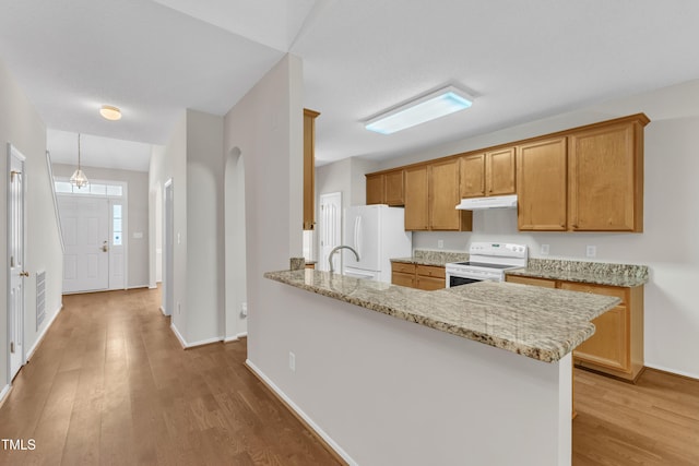 5513 Enoree Ln, Raleigh, NC 27616 - kitchen featuring white appliances, under cabinet range hood, light wood-type flooring, and light stone countertops