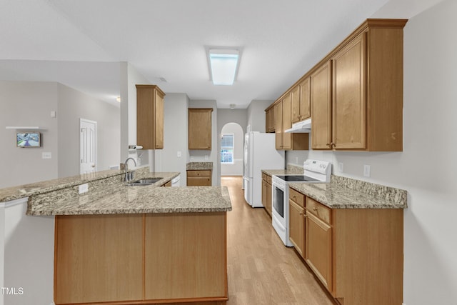 5513 Enoree Ln, Raleigh, NC 27616 - kitchen with white appliances, under cabinet range hood, light wood-type flooring, a peninsula, and arched walkways