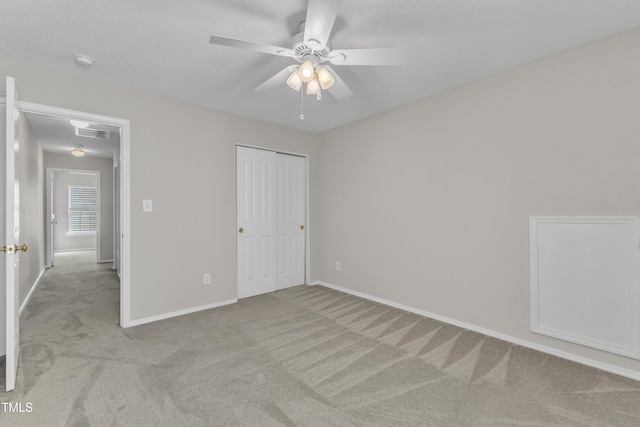 5513 Enoree Ln, Raleigh, NC 27616 - unfurnished bedroom featuring carpet flooring, a closet, and ceiling fan