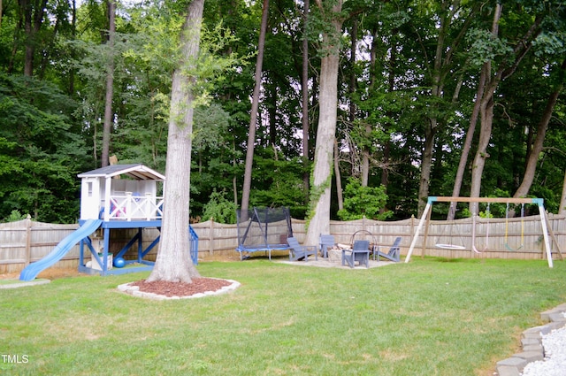 114 Bridle Path, Pittsboro, NC 27312 - fenced backyard with a trampoline and a playground