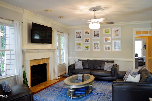114 Bridle Path, Pittsboro, NC 27312 - living area with a ceiling fan, ornamental molding, a large fireplace, and wood finished floors