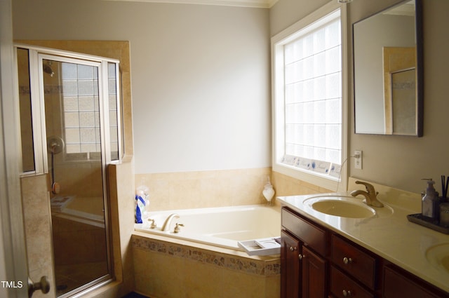 114 Bridle Path, Pittsboro, NC 27312 - bathroom with a bath, double vanity, a shower stall, and crown molding