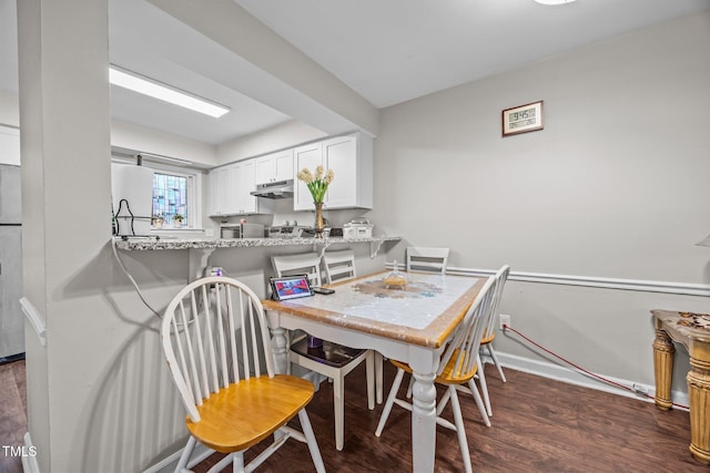 7020 Longstreet Dr Unit A, Raleigh, NC 27615 - dining room with dark wood-type flooring and baseboards