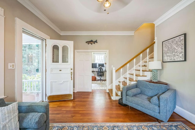 1213 Pierce St, Raleigh, NC 27605 - entrance foyer with ornamental molding, wood finished floors, stairway, and a ceiling fan