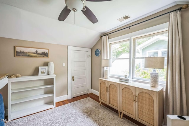 1213 Pierce St, Raleigh, NC 27605 - living area featuring lofted ceiling, wood finished floors, and ceiling fan