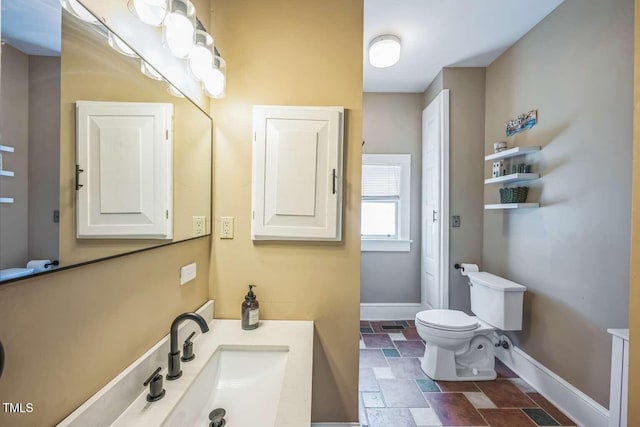 1213 Pierce St, Raleigh, NC 27605 - bathroom featuring stone finish floors and vanity