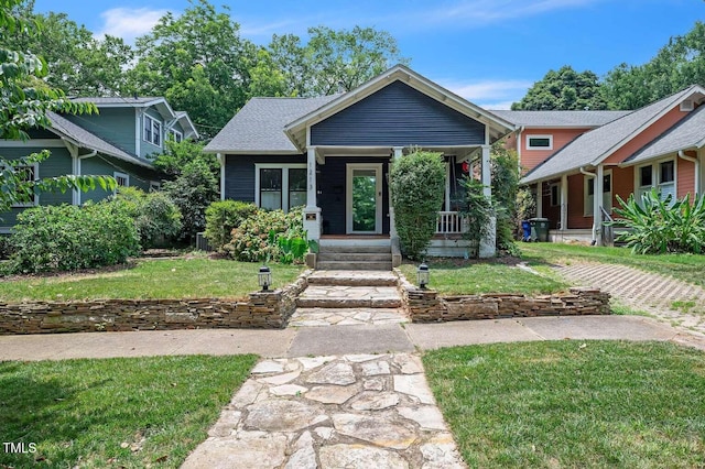 1213 Pierce St, Raleigh, NC 27605 - bungalow-style house with a front lawn and covered porch