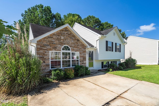 1814 Shiva Ct, Durham, NC 27703 - view of front of home featuring stone siding and a front lawn