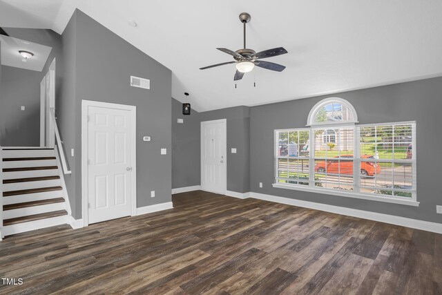 1814 Shiva Ct, Durham, NC 27703 - unfurnished living room featuring dark wood-style floors, a ceiling fan, high vaulted ceiling, and stairs