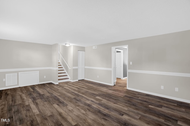 1814 Shiva Ct, Durham, NC 27703 - unfurnished room with dark wood finished floors and stairs