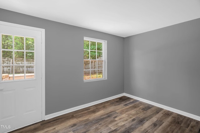 1814 Shiva Ct, Durham, NC 27703 - spare room featuring dark wood-style flooring and baseboards
