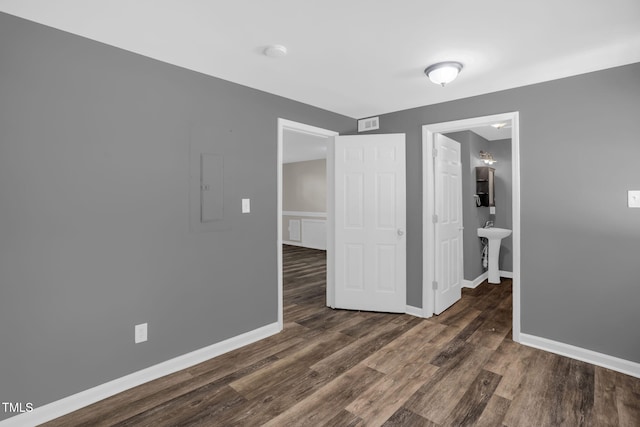 1814 Shiva Ct, Durham, NC 27703 - spare room featuring wood finished floors, electric panel, and a smoke detector