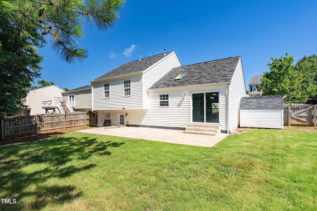 1814 Shiva Ct, Durham, NC 27703 - back of property featuring a patio, a fenced backyard, a shed, entry steps, and a shingled roof