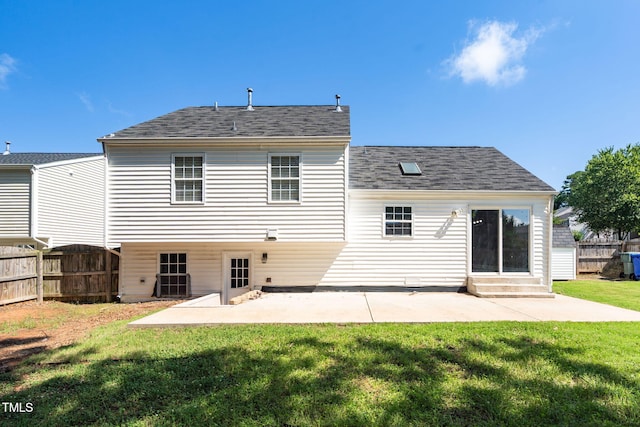 1814 Shiva Ct, Durham, NC 27703 - rear view of property with entry steps, a patio, and a shingled roof
